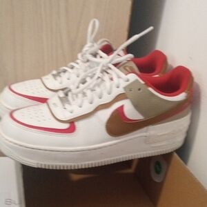 Nike White and Gold Athletic Shoes